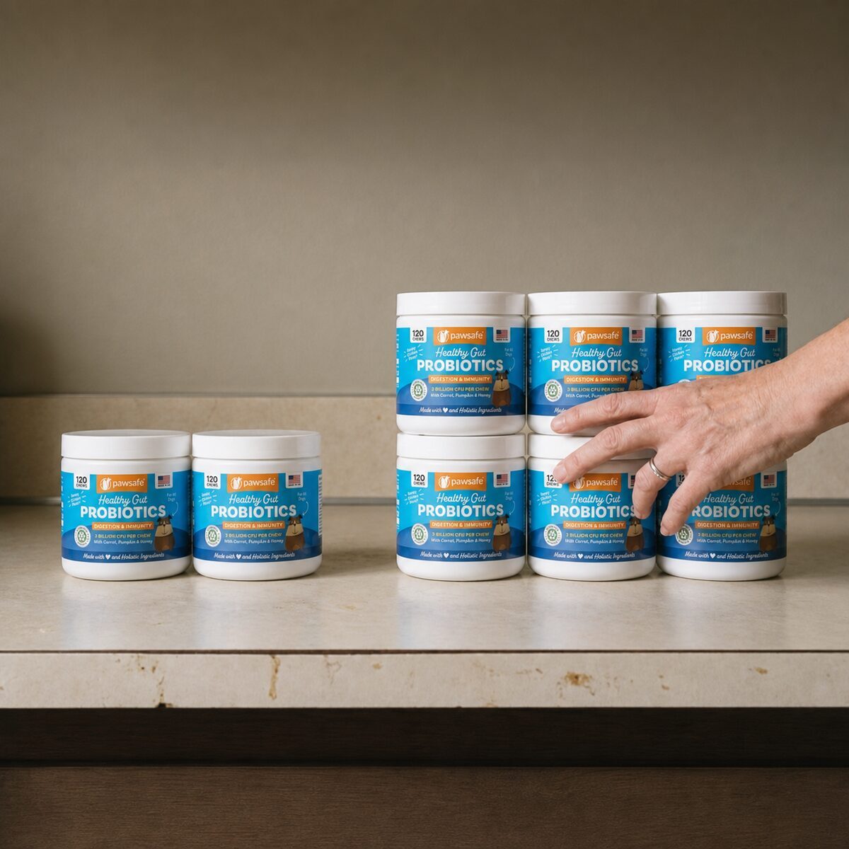 Two tubs beside a stack of six tubs with a hand reaching for the larger group
